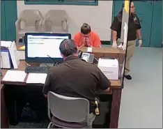  ??  ?? This photo from video released Thursday, Sept. 13, by the Kaufman County Sheriff’s Office in Kaufman, Texas, shows Dallas police Officer Amber Guyger getting booked after turning herself in.KaUfman CoUnty SherIff’S offICe JaIl VIa aP