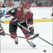  ?? AP FILE ?? Arizona Coyotes left wing Taylor Hall skates with the puck against the Minnesota Wild on Dec. 19, 2019.