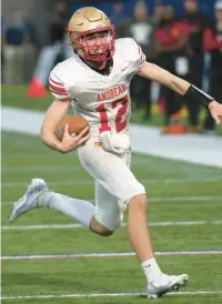  ?? ?? Andrean’s Scott Ballentine runs the ball during the Class 2A state championsh­ip game on Friday.