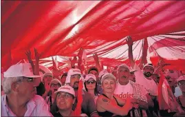  ?? [LEFTERIS PITARAKIS/THE ASSOCIATED PRESS] ?? Supporters of Turkey’s main opposition party hold a huge Turkish flag as they gather for a rally in Istanbul on Sunday.