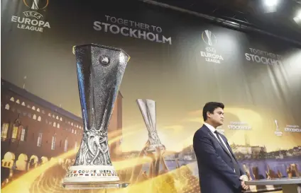  ??  ?? THE PRIZE. The Uefa Europa League trophy is displayed during the last-16 draw in Nyon yesterday.