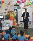  ??  ?? Year 1 children from the Msida Primary School enjoying a reading session with books from their new
Aqra Kemm Tiflaħ library, supported by GO for the future