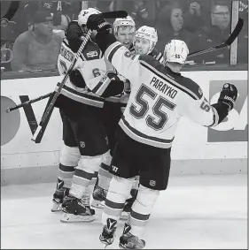  ?? AP/STACY BENGS ?? Joel Edmundson (left) Magnus Paajarvi (center) Jaden Schwartz (right) and Colton Parayko (55) celebrate after Paul Stastny scored in the third period to give the St. Louis Blues a 3-1 lead. After the Minnesota Wild scored twice to send the game to...