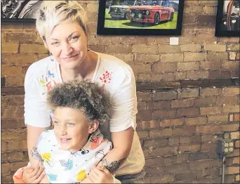  ?? KATHLEEN HENNESSEY — THE ASSOCIATED PRESS ?? Alexis Arnold, 44, in De Pere, Wis., with her 6-year-old daughter Jade Arnold, has wondered, “Why are we so broken right now?”