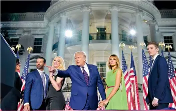  ?? AFP ?? Donald Trump Jr., Tiffany Trump, President Donald Trump, first lady Melania Trump and Barron Trump stand on stage on the South Lawn of the White House on the fourth day of the Republican National Convention. —