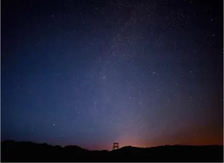  ??  ?? Led lamps with soft light are used in the port of Lauwersoog in order to reduce light pollution. you’ve never seen a starry sky quite like this: The Lauwersmee­r national Park is known for its clear celestial views – provided there are no clouds. — Photos: Marketing Groningen/dpa