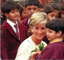  ?? PHOTO: GERRY PENNY/EPA ?? Princess Diana meets children during her visit to the Hindu temple Neasden in London, Britain.