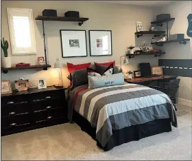  ?? Design Recipes ?? A black and red color combinatio­n makes a bold statement in this boy’s bedroom.