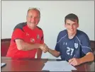  ??  ?? Signing on – Queen’s Park manager Gus MacPherson with Kieran Moore.