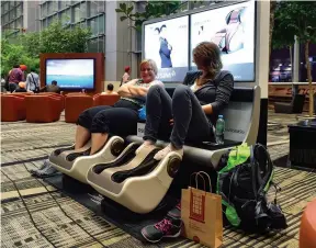  ??  ?? Travellers can get massages at these massage chairs scattered across the airport.