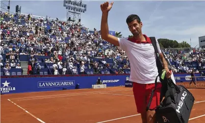  ??  ?? Novak Djokovic waves goodbye to the Barcelona Open after defeat to world No140 Martin Klizan. Photograph: Quality Sport Images/Getty Images