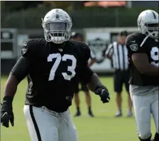  ?? AP PHOTO/JEFF CHIU) ?? Oakland Raiders’ Maurice Hurst (73) warms up during nFL football practice in napa, on Wednesday.