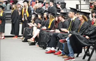  ??  ?? Red shoes were a favorite for graduates at the ceremony Saturday.