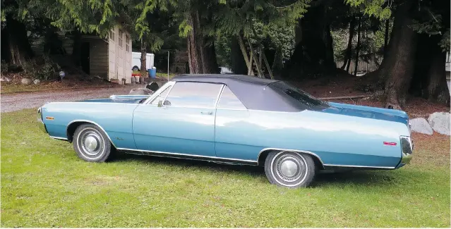  ??  ?? Alyn Edwards had his restored 1970 Chrysler 300 convertibl­e painted its original teal colour. It was only one of 1,077 convertibl­es built in the 1970 model year.