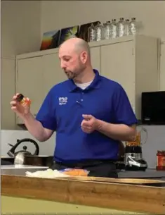  ??  ?? Eric Myers talks about ingredient­s during a Healthy Cooking demonstrat­ion at West-Mont Christian Academy in North Coventry.