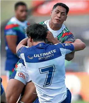  ?? GETTY IMAGES ?? Warriors fullback Roger Tuivasa-Sheck is rounded up by the Bulldogs defence at Mt Smart Stadium in Auckland yesterday.