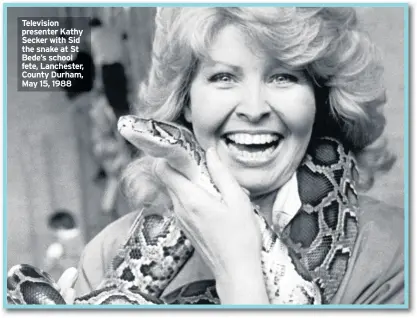  ??  ?? Television presenter Kathy Secker with Sid the snake at St Bede’s school fete, Lanchester, County Durham, May 15, 1988