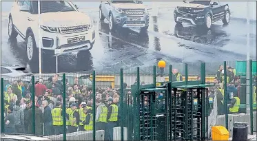  ??  ?? UNCERTAIN FUTURES: Angry workers outside the JLR plant in Halewood, Merseyside