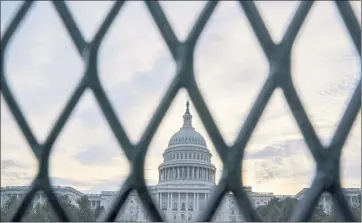  ?? PHOTOS BY J. SCOTT APPLEWHITE — THE ASSOCIATED PRESS ?? Security fencing has been reinstalle­d around the Capitol in Washington ahead of today’s rally by supporters of former President Donald Trump who are demanding the release of rioters arrested in connection with the Jan. 6 insurrecti­on.