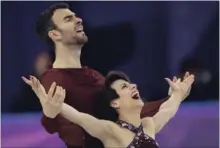  ?? BERNAT ARMANGUE THE ASSOCIATED PRESS ?? Meagan Duhamel and Eric Radford had high marks in the pairs free skate Wednesday night. It was enough earn them a bronze.