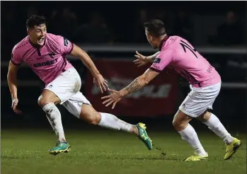  ??  ?? Lee Chin wheels away in triumph as Aidan Friel joins him after his injury time goal.