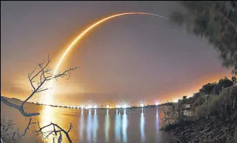  ?? AP ?? This photo shows a time exposure from the shore of the Banana River near Port Canaveral of the launch of the Spacex Falcon 9 rocket from Cape Canaveral, Florida, on Thursday.