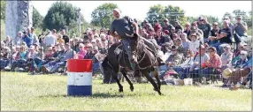  ?? PHOTOGRAPH COURTESY OF RUSS WILSON ?? race for the finish during the adult barrel races for a time of 17.261 seconds to take first place. Joe Sams leans Kit into the turn on the senior barrel race. They took first place for a time of 19.399 seconds.