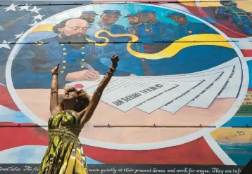  ?? STUART VILLANUEVA/AP ?? Dancer Prescylia Mae, of Houston, performs during a dedication ceremony for the mural “Absolute Equality” in downtown Galveston, Texas, on June 19, 2021.