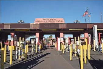  ?? AP ?? The border crossing sits closed Dec. 15 at Lukeville. U.S. authoritie­s say the Arizona crossing on the most direct route from Phoenix to the nearest Mexico beaches will reopen today, one month after it closed in response to a large migrant influx.
Who has been making dayslong trips from Sonoyta, Sonora, to Ajo, Arizona, for her job