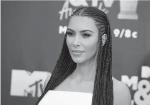  ?? AP PHOTO/JORDAN STRAUSS ?? Kim Kardashian West arrives at the MTV Movie & TV Awards at the Barker Hangar in Santa Monica, Calif., on June 16, 2018.