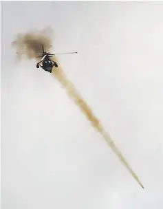  ?? — Reuters photo ?? A Philippine Airforce helicopter releases a rocket as government troops continue their assault against insurgents from the Maute group, who have taken over large parts of Marawi city, Philippine­s.