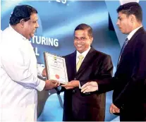  ??  ?? Lucky Kottawa Factory official accepts the award