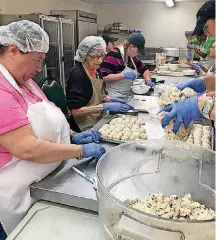  ?? [PHOTOS PROVIDED] ?? Volunteers make shortbread cookies with pecans called Mamoul that will be sold at St. Elijah’s Food Festival on Nov. 2 and Nov. 3 at St. Elijah Orthodox Christian Church in northwest Oklahoma City.