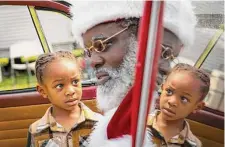  ?? ?? Kairo Dunbar, 4, checks out Santa’s beard during a Storytime with Santa event on Saturday at Kindred Stories in Third Ward.