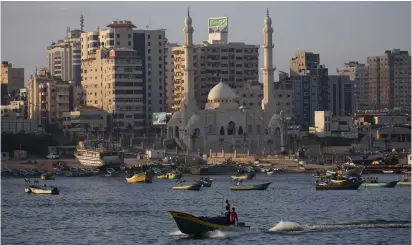  ?? (Reuters) ?? FISHING BOATS on the coast of Gaza.