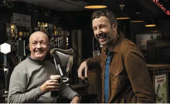  ??  ?? Actor Chris O’Dowd pictured with Sean O’Mahony, owner and publican at the Faha Court Pub during Chris’ visit to Kerry at the weekend.