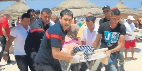  ?? Picture: Universal News and Sport. ?? A Tunisian television image of the wounded being taken from the beach following the attack in Sousse.