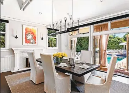  ??  ?? A FORMAL dining room sits near the entry of Schultz’s former home, which sold for $5.05 million.
