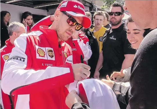  ?? DAVE SIDAWAY/MONTREAL GAZETTE ?? Four-time F1 world champion Sebastian Vettel, who competes at Circuit Gilles Villeneuve this weekend, met fans on Crescent St. Thursday.