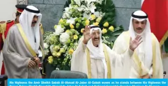  ??  ?? His Highness the Amir Sheikh Sabah Al-Ahmad Al-Jaber Al-Sabah waves as he stands between His Highness the Crown Prince Sheikh Nawaf Al-Ahmad Al-Jaber Al-Sabah and National Assembly Speaker Marzouq Al-Ghanem.