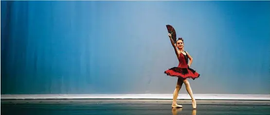  ?? Annie Mulligan ?? A ballet dancer competes on stage at the University of Houston’s Cullen Performanc­e Hall as part of the Youth America Grand Prix regional semifinals Saturday.