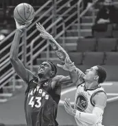  ?? Chris O'Meara / Associated Press ?? The Raptors’ Pascal Siakam, left, shoots over Juan Toscano-Anderson. Siakam scored 36 points.