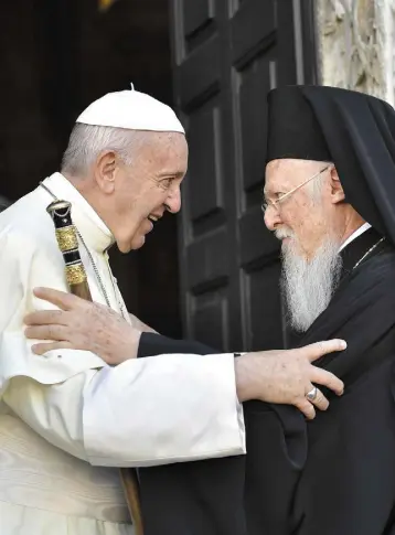  ??  ?? EMBRACING: Pope Francis hugs Patriarch Bartolomeo I as he arrives to attend a prayer for peace in the Middle East at the St Nicholas Basilica in Bari, Italy, yesterday. (Inset) Brother Kevin