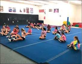  ?? Photo by Jessica Decker ?? The girls that showed up for the Sparks tryout are pictured getting warmed up.