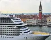  ?? AFP ?? RETURN OF TOURISTS: A cruise ship, which arrived on June 3 for the first time in 17 months, sails across Venice on Saturday.