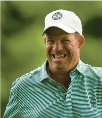  ?? ?? Country Club of Scranton head profession­al Mike Molino jokes with spectators as he walks off the ninth tee Thursday during the first round