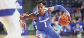  ?? JOE RONDONE/THE COMMERCIAL APPEAL ?? Memphis Tigers guard Tyler Harris probes the Tulsa Golden Hurricane defense during their game at the Donald Reynolds Center in Tulsa, Okla. on Jan. 22, 2020.