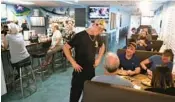  ?? ?? Mike Focarazzo, owner of the popular Fish Shack, speaks with customers during opening day at his new location on Federal Highway in Lighthouse Point.