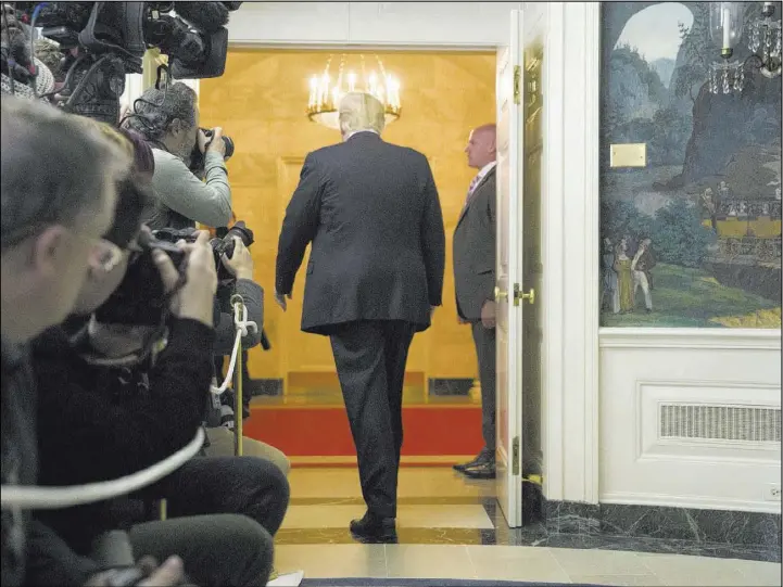  ?? Alex Brandon The Associated Press ?? President Donald Trump departs after speaking Saturday at the White House about the partial government shutdown, immigratio­n and border security.