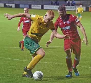  ??  ?? ●
Sion Bradley (left, in previous action) was on target again for Caernarfon